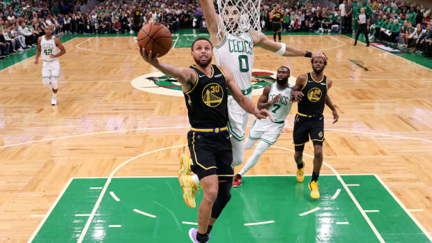 Jun 10, 2022; Boston, Massachusetts, USA; Golden State Warriors guard Stephen Curry (30) attempts a layup against Boston Celtics forward Jayson Tatum (0) during the first half of game four in the 2022 NBA Finals at the TD Garden. Mandatory Credit: Kyle Terada-USA TODAY Sports